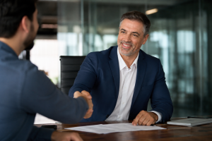 Business handshake representing EB-5 investor visa agreement